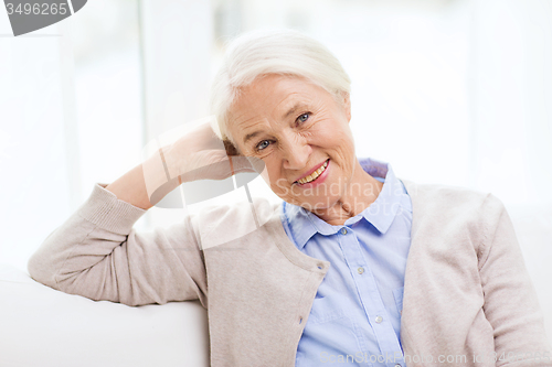 Image of happy senior woman at home