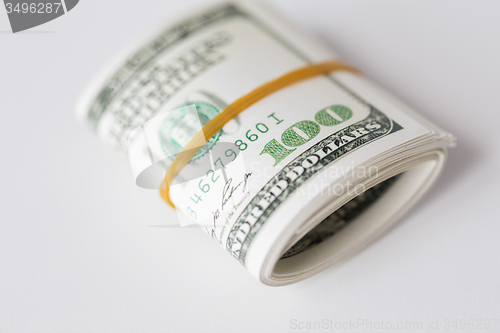 Image of close up of dollar money packet tied with rubber