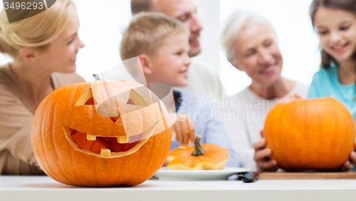 Image of helloween pumpkin lantern over happy family