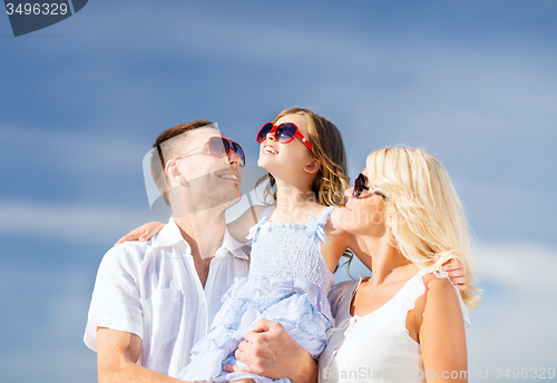 Image of happy family with blue sky