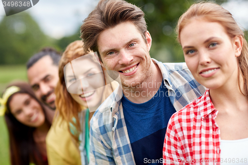 Image of group of smiling friends outdoors
