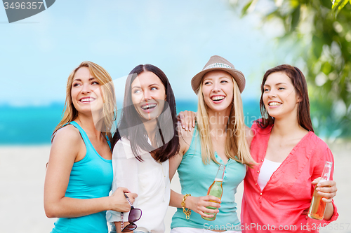 Image of girls with drinks on the beach