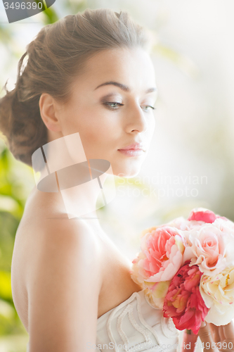 Image of young woman with bouquet of flowers