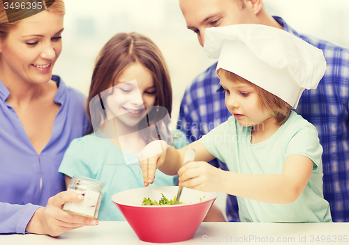 Image of happy family with two kids eating at home