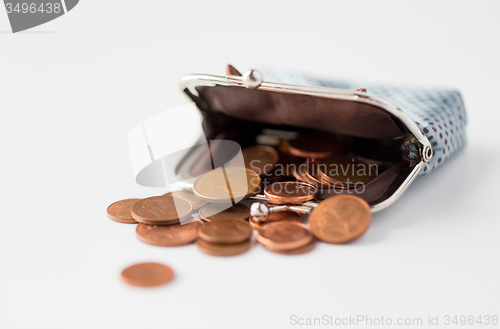 Image of close up of euro coins and wallet on table