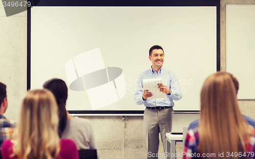 Image of group of students and teacher with notepad