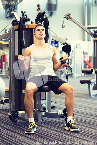 Image of man exercising on gym machine