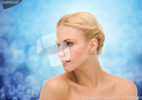 Image of beautiful young woman with bare shoulders