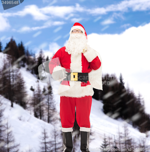 Image of man in costume of santa claus with bag