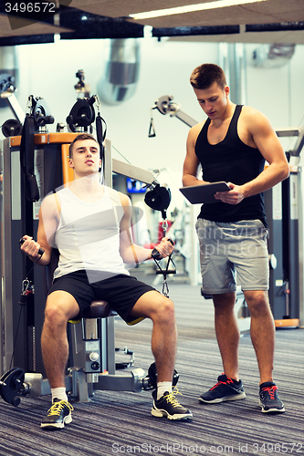 Image of man exercising on gym machine