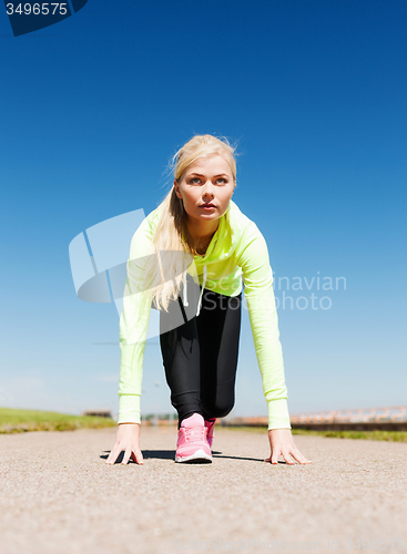Image of woman doing running outdoors
