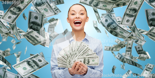 Image of happy laughing businesswoman with dollar money