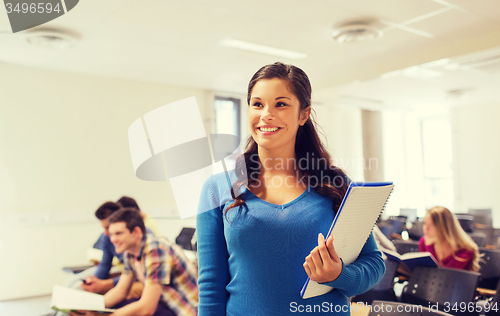 Image of group of smiling students in lecture hall