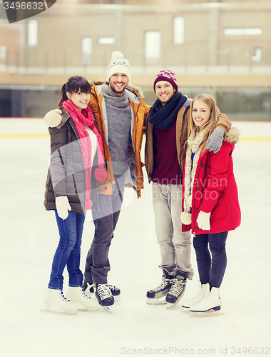 Image of happy friends on skating rink