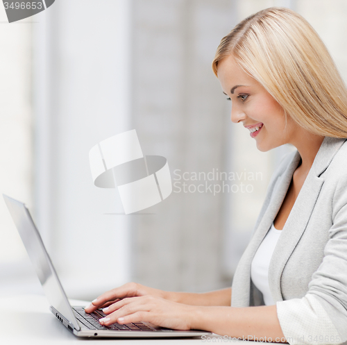 Image of businesswoman with laptop