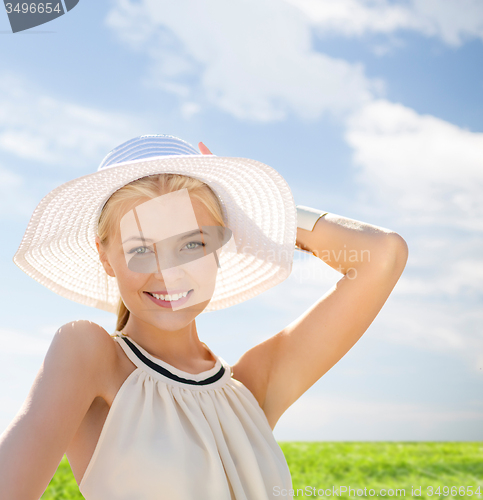 Image of beautiful woman enjoying summer outdoors