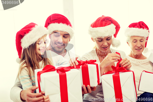 Image of happy family sitting on couch at home