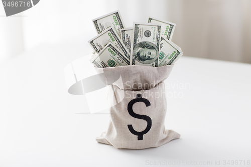 Image of close up of dollar paper money in bag on table