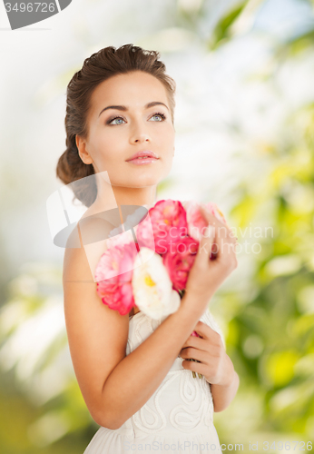 Image of woman with bouquet of flowers