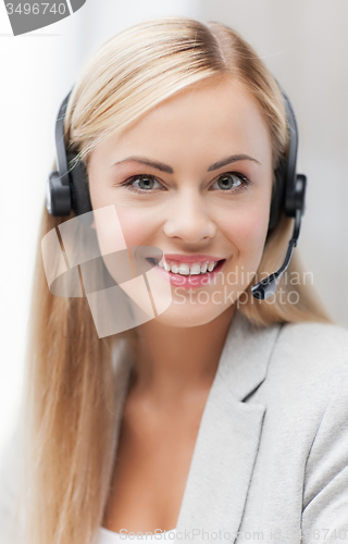 Image of friendly female helpline operator