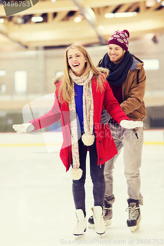 Image of happy couple on skating rink