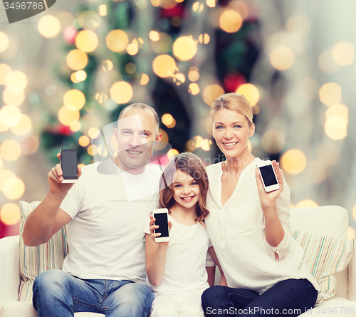 Image of happy family with smartphones