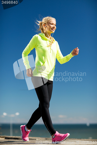 Image of woman doing sports outdoors
