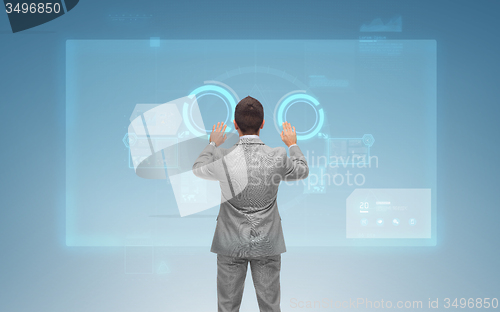 Image of businessman working with virtual screens