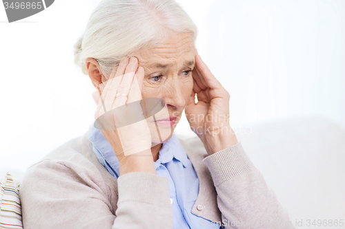 Image of face of senior woman suffering from headache