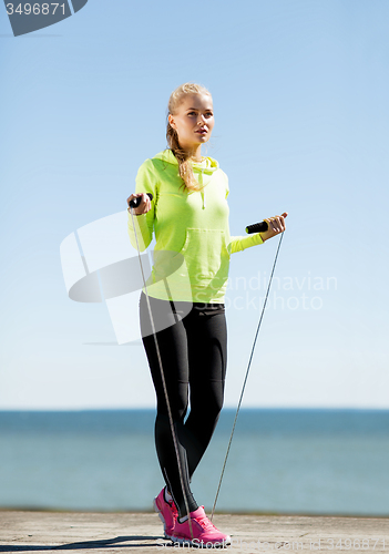 Image of woman doing sports outdoors