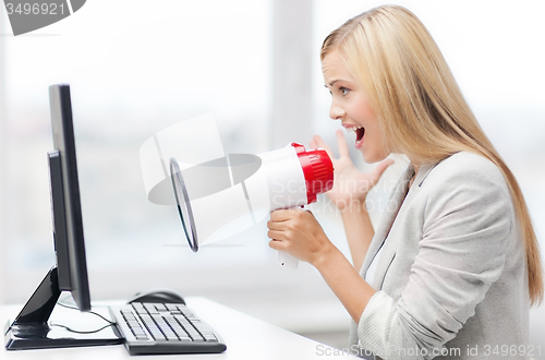 Image of strict businesswoman shouting in megaphone