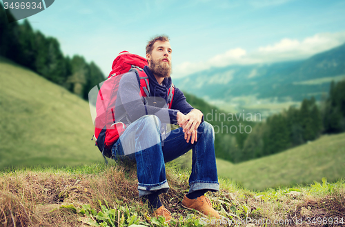 Image of man with backpack hiking