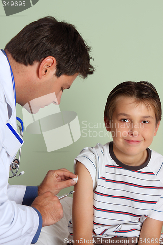 Image of Doctor injecting child vaccine