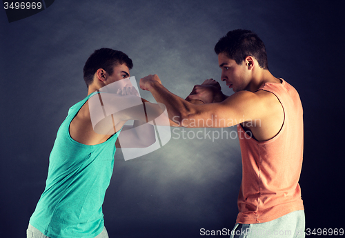 Image of young men wrestling