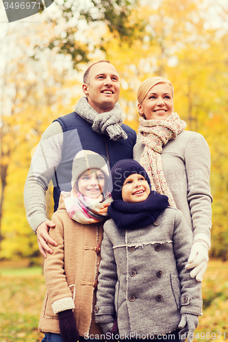Image of happy family in autumn park