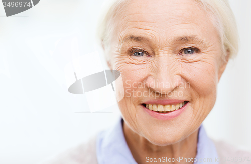 Image of happy senior woman face at home