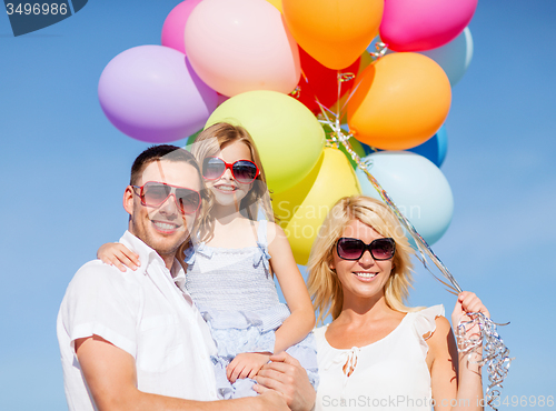Image of family with colorful balloons