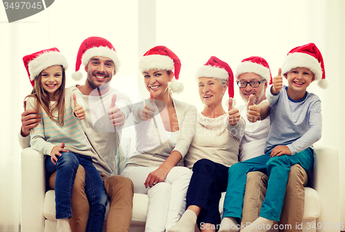 Image of happy family sitting on couch at home