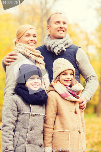 Image of happy family in autumn park