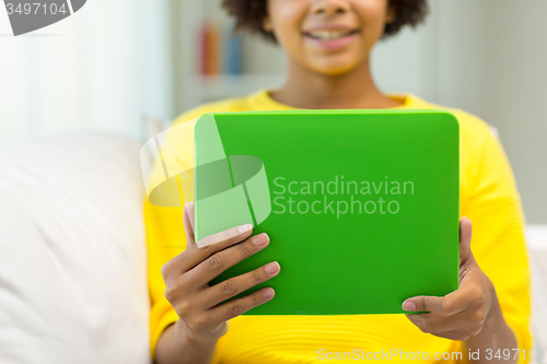 Image of happy african american woman with tablet pc