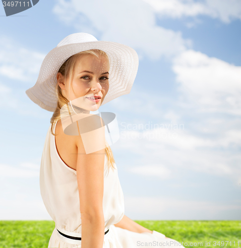 Image of beautiful woman enjoying summer outdoors