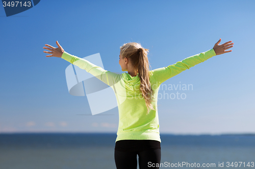 Image of woman doing sports outdoors