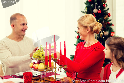 Image of smiling family having holiday dinner at home