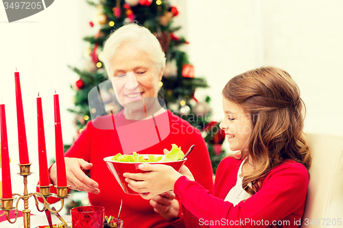 Image of smiling family having holiday dinner at home