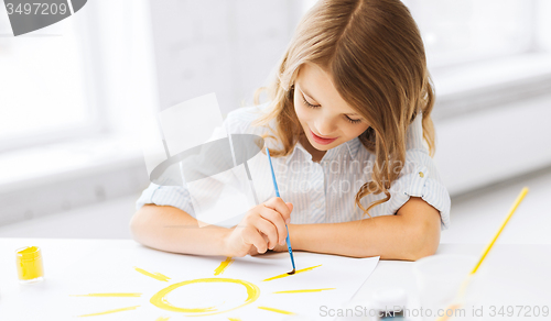 Image of little girl painting picture