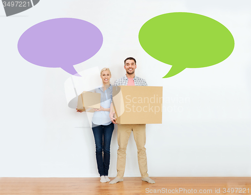 Image of couple with cardboard boxes moving to new home