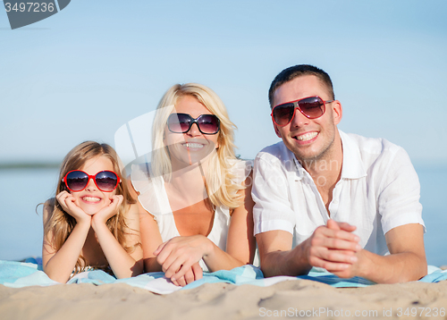 Image of happy family on the beach