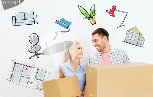 Image of couple with delivery boxes moving to new home