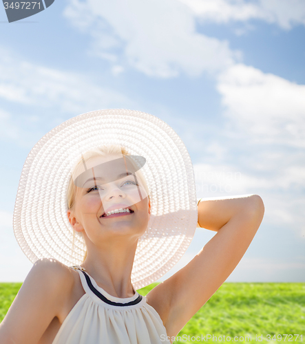 Image of beautiful woman enjoying summer outdoors