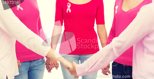 Image of close up of women with cancer awareness ribbons